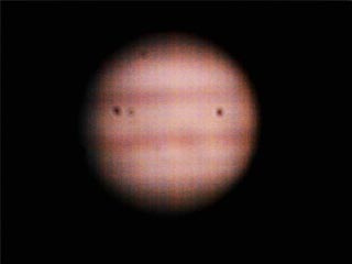 Jupiter
	
This is a shot of Jupiter with the WebCam plugged into the Meade Series 4000 2x Barlow (yielding f/22). The black spots on the image that are (I think!) dust I have yet to clean off the protective glass covering on the webcam's ccd. The finished result is a 3 image overlay using PhotoShop.


Keywords: Jupiter