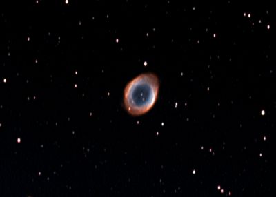M57 Ring Nebula in Lyra
This and the next image were, believe it or not, processed from the same data. This one using [url=http://www.weingrill.net/picfits.html]Jörg Weingrill's CYMG[/url] Color Plug-in for the MX7C and the next one using AstroArt's RGB synthesis plug-in. The images are a stack of 46, 20 second shots taken in fast mode and both final images had the levels tweaked in Photoshop. The amazing difference is due (I think) to the fact that the MX7C builds color data thanks to cyan, yellow, magenta and green filters deposited directly on the CCD surface making the color rendition in RGB not quite as accurate. Jörg's plug-in is currently still under development and for the time being there is no batch processing option but it sure does look promising!
Keywords: M57 Ring Nebula Lyra